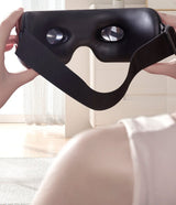 Serenity Eye Massager held in hands